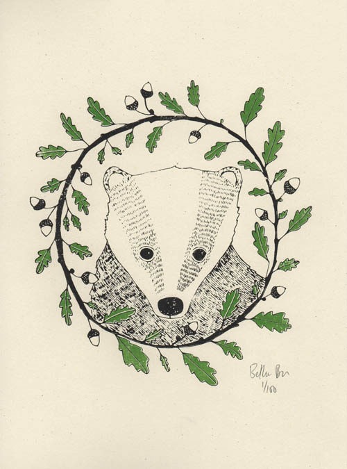 bScreen print of a badger with black ink surrounded by oak leaves and acorn in an oak wreath. 2 colour print: black and green.