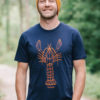 Model wearing lobster mens T-shirt. Orange lobster on navy T-shirt