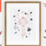 Photograph of a framed lobster print. Orange lobster illustration with shells surrounding it.