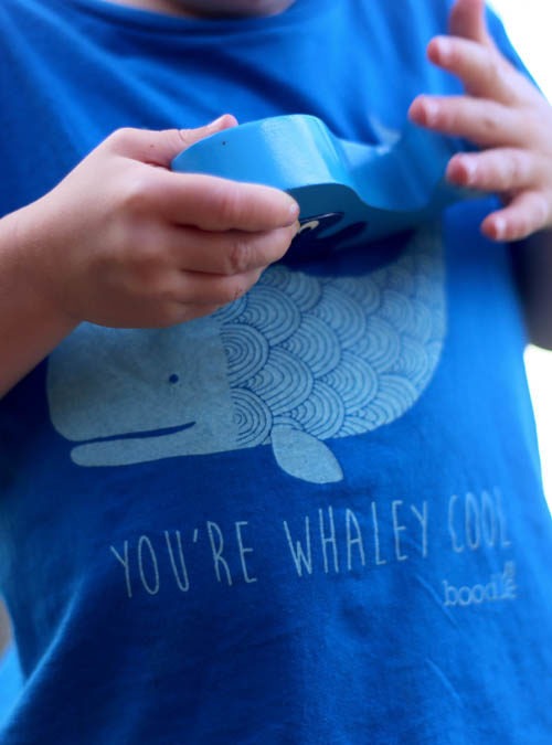 close up of whaley cool kids t-shirt. Blue T-shirt featuring a cute illustration of a whale