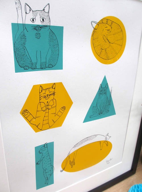 close up of cat art print featuring illustrations of cats over shapes