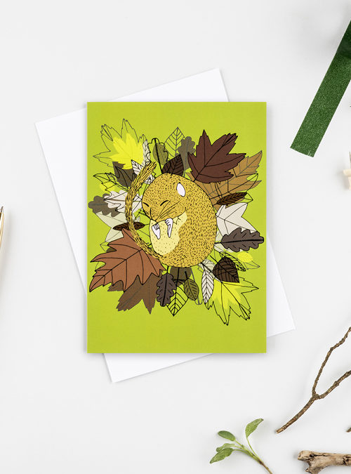 photo of a Dormouse card featuring an illustration of a dormouse asleep in leaves