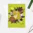 photo of a Dormouse card featuring an illustration of a dormouse asleep in leaves
