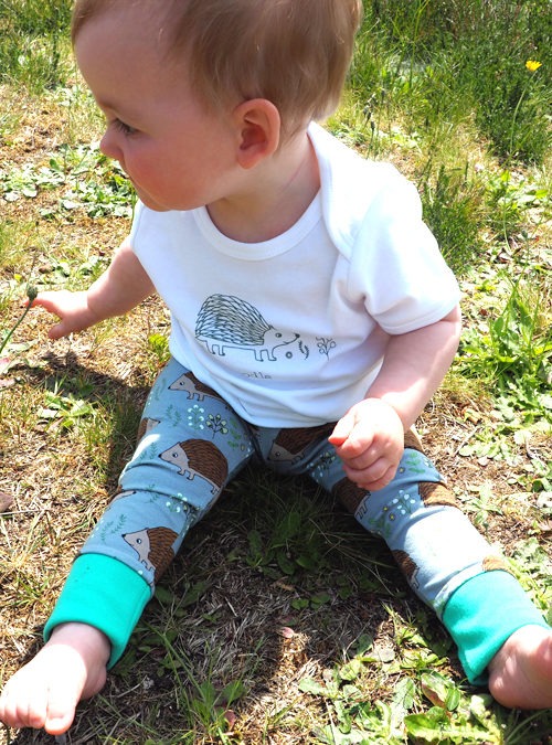 Kid model wearing hedgehog leggings and T-shirt together