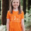 Kid model wearing orange T-shirt featuring an illustration of 2 foxes going camping with the text 'Lets go on an adventure' underneath