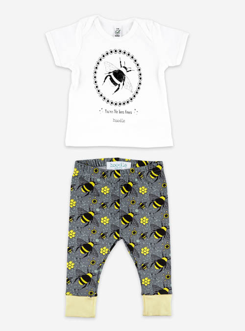 Bee baby outfit. Bee baby T-shirt featuring an illustration of a bee surrounded by honeycomb with the wording 'You're the bees' underneath. Paired with grey organic cotton leggings featuring a repeat pattern of bees, honeycomb and flowers. Organic cotton baby set