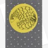 Photo of a Grey pangolin card featuring an illustration of a pangolin on a yellow circle on a grey background