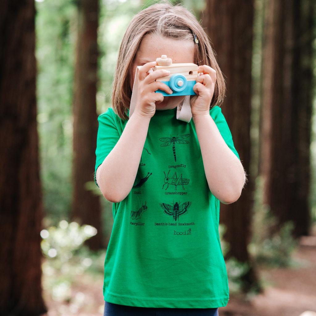 Organic green T-shirt featuring 6 bugs