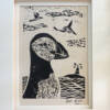 Close up of puffin print in a mount