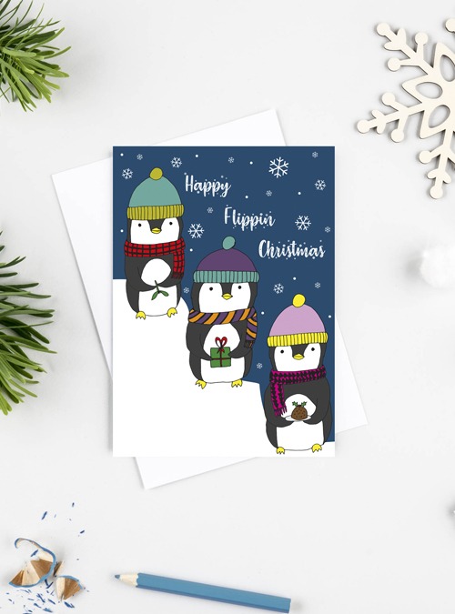 cute card featuring 3 penguins with presents featuring the wording 'Happy flippin Christmas'