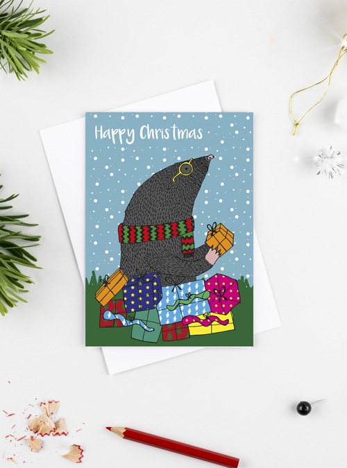 Mole christmas card showing a mole surrounded by lots of presents