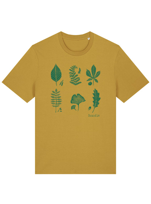 Photograph of a mustard T-shirt with leaf design in green