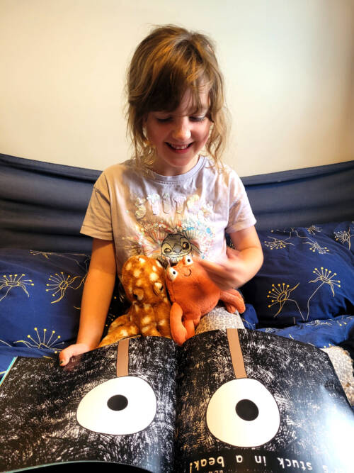 model child reading clipper and clawzo the childrens book
