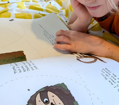 kid reading sloth moth book
